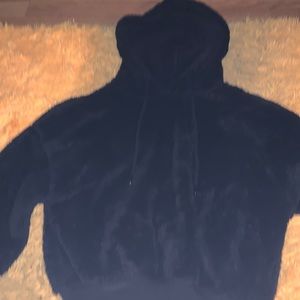 Black cropped fuzzy hoodie with strings & elastic waist and arms.Literally new!